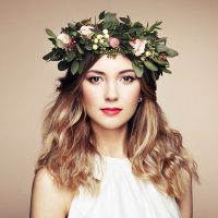 beautiful-blonde-woman-with-flower-wreath-on-her-PK5CC55.jpg